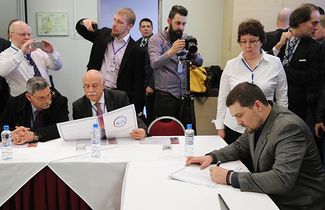 European parliament members Eleftherios Sinadinos and Georgos Epitideios during the signing of the resolution of the Russian international conservative forum.