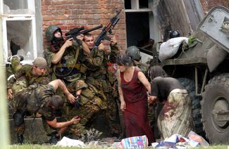 Soldiers and hostages during the assault on the schoolhouse