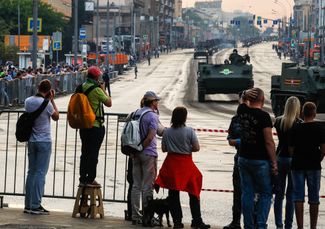 People in Moscow watch preparations on June 18, 2020 for the city’s rescheduled Victory Day parade