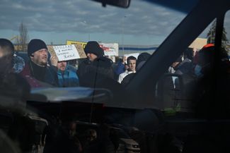 A help point for refugees in a supermarket parking lot in the Polish city of Przemyśl. From here, people can take free transport to other towns and cities in Poland. February 26, 2022.