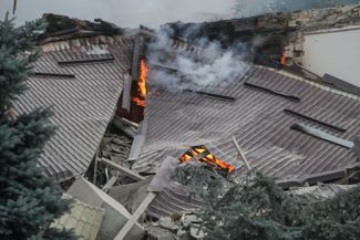 A building that caught fire following artillery shelling in Stepanakert. October 4, 2020.