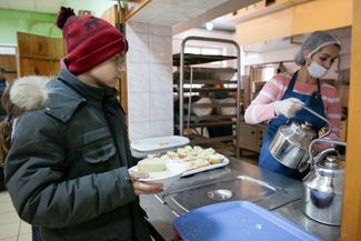 A boy from the “Donetsk People’s Republic” in a temporary accommodation center set up at a summer camp facility in Voronezh. February 20, 2022.