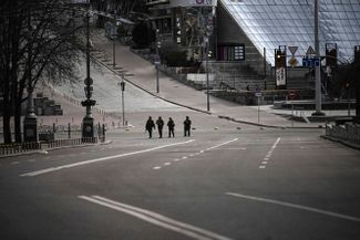 A military patrol in Kyiv, which is under citywide curfew between 5 p.m. and 8 a.m. The authorities say they will consider anyone caught after hours to belong to “enemy sabotage and reconnaissance groups.”