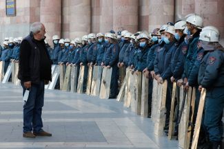 Police officers outside Armenia’s House of Government, following protests