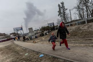 People trying to escape from Irpen. The city is located eight kilometers from Kyiv — in the path Russian troops have been taking to reach the capital