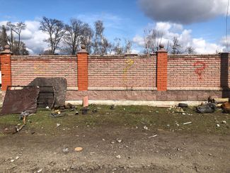 Question marks left by Ukrainian bomb checkers on a fence outside a private home in Bohdanivka. April 11, 2022