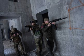 Members of a Ukrainian far-right group training to repel an attack at an abandoned construction site in Kharkiv