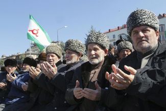 Protesters pray during the March 26 protest in Nazran against the referendum law.