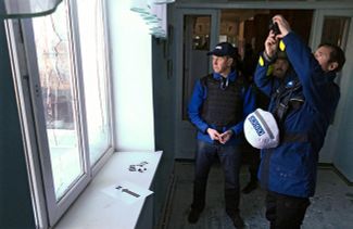 OSCE observers document the effects of Ukrainian army shelling upon villages in Staromykhailivka (near Donetsk), February 18, 2016.