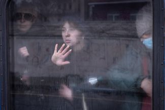 A woman in an evacuation train going from Irpin to Kyiv. Two thousand civilians have managed to escape from Irpin, where active hostilities are ongoing. March 4, 2022