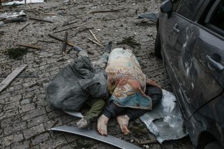 Bodies of victims of the shelling of Freedom Square in Kharkiv. “A missile in Kharkiv’s central square – naked, undisguised terror,” President Volodymyr Zelensky said of the attack. 