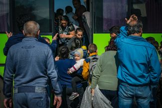 The line for a bus evacuating people from Stepanakert to the Armenian capital, Yerevan. October 3, 2020.