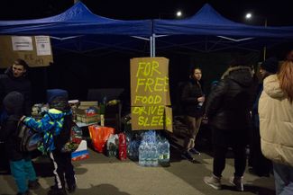 In the village of Vyšné Nemecké on the Ukrainian-Slovakian border, volunteers and priests from Slovakia’s Greek Orthodox Church set up a collection point for items to help refugees. February 25, 2022.