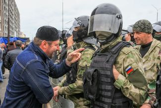 Protesters and police officers in Magas’s central square. October 5, 2018