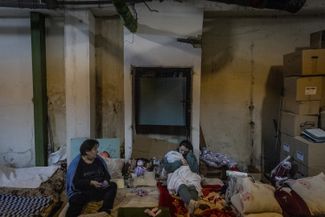 A mother with her child, who is being treated in the bomb shelter of the pediatric department of the Okhmatdet Children's Hospital. Kyiv, February 28, 2022.