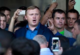 Communist Party candidate Andrey Ishchenko makes a speech after the second round of voting, September 17, 2018