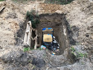 A firing position outfitted by Russian soldiers on the side of a rural road in Bohdanivka. April 11, 2022