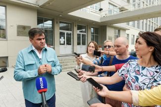 Alexey Nechayev (left) at a press conference in July 2020