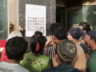 Uyghurs search for missing relatives in Kashgar, August 3, 2009