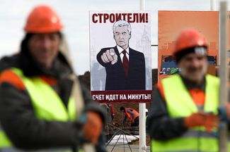 A new hospital designed for coronavirus patients under construction in Moscow on March 21, 2020. Sign reads: “Builders! Every minute counts!”