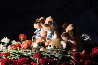 In the courtyard outside the collapsed apartment building, a memorial to the victims. January 1, 2019.